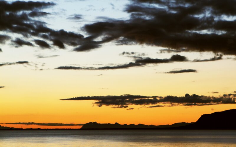 Silhouetted Mountains at Sunset — Orange