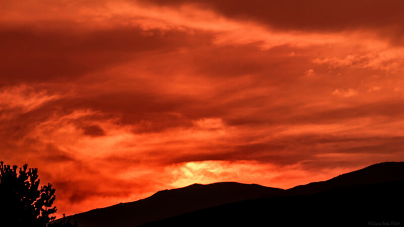 Silhouetted Mountains at Sunset — Red, Dramatic, Photograph