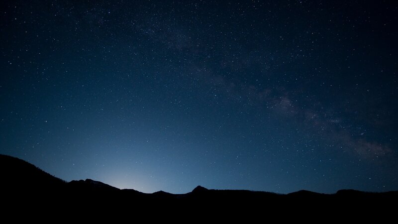 Silhouetted Mountains under Stars — Black