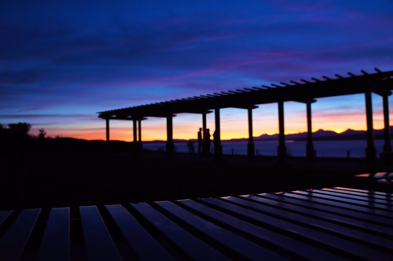 Silhouetted People at Sunset — Blue