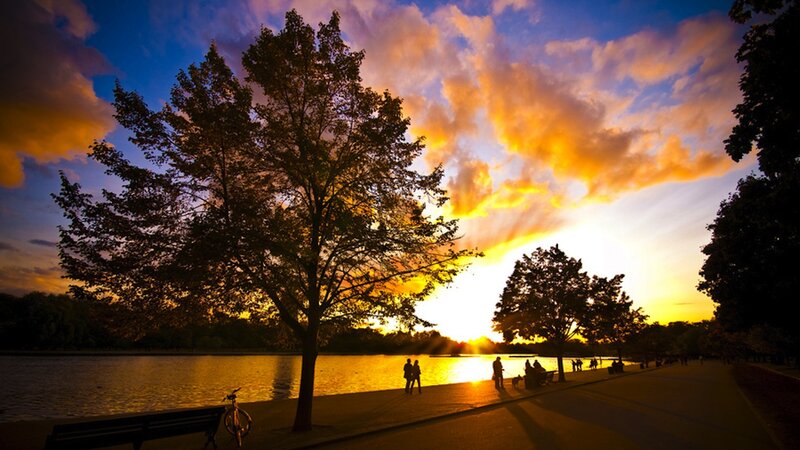 Silhouetted People at Sunset — Orange, Dramatic