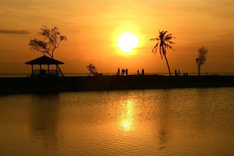 Silhouetted People at Sunset — Orange