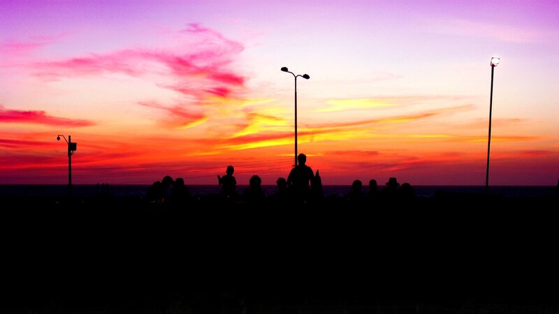 Silhouetted People at Sunset — Purple, Dramatic
