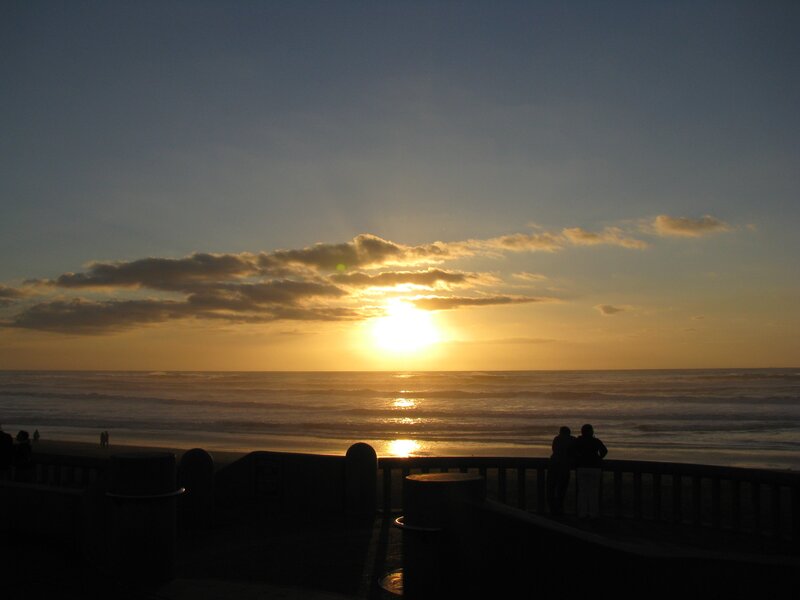 Silhouetted People at Sunset — Yellow, Serene, Photograph, Ocean
