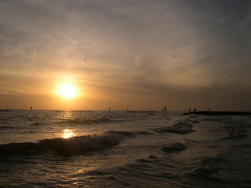Silhouetted People at Sunset — Yellow