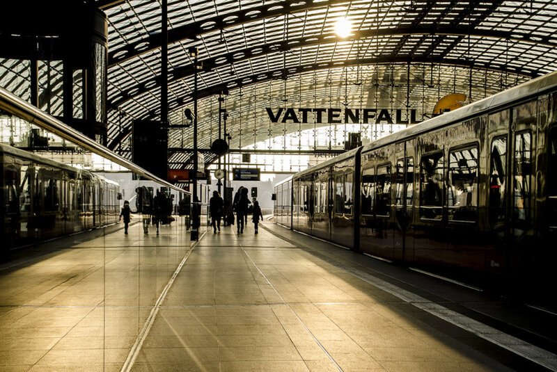 Silhouetted People at Train Station
