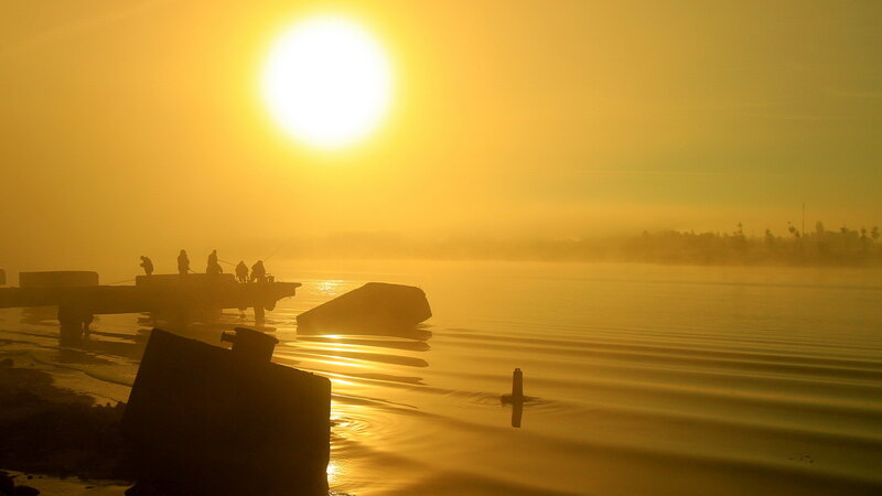 Silhouetted People Fishing — Yellow