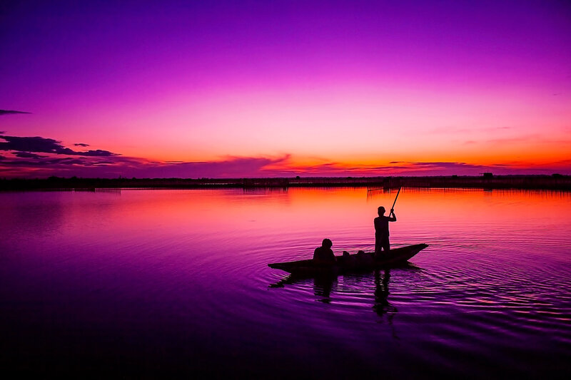 Silhouetted People in Boat — Purple