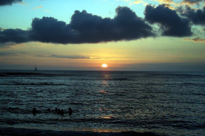 Silhouetted People in Ocean — Blue