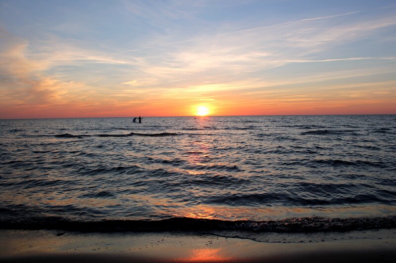 Silhouetted People in Ocean