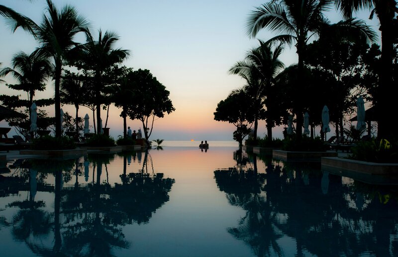 Silhouetted People in Pool