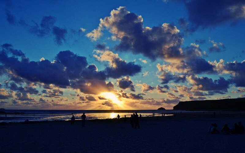 Silhouetted People on Beach — Blue, Dramatic, Sunset, Photograph, Clouds, Sun