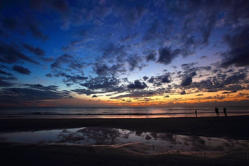 Silhouetted People on Beach — Blue, Dramatic, Sunset, Photograph, Clouds