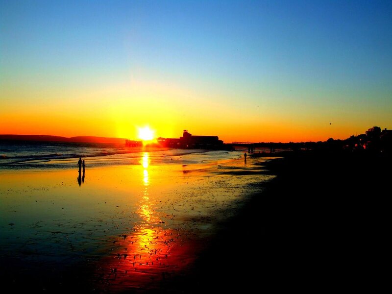 Silhouetted People on Beach — Blue, Serene, Sunset