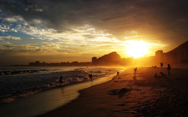 Silhouetted People on Beach — Gold, Dramatic