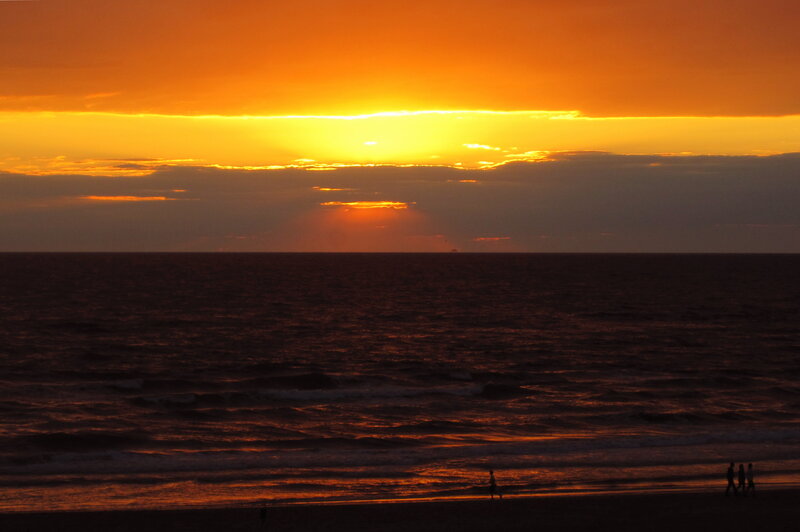 Silhouetted People on Beach — Orange, Dramatic, Sunset, Photograph, Ocean, Sky