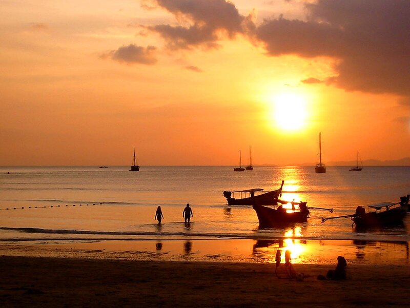 Silhouetted People on Beach — Orange, Serene, Sunset, Photograph, Boats