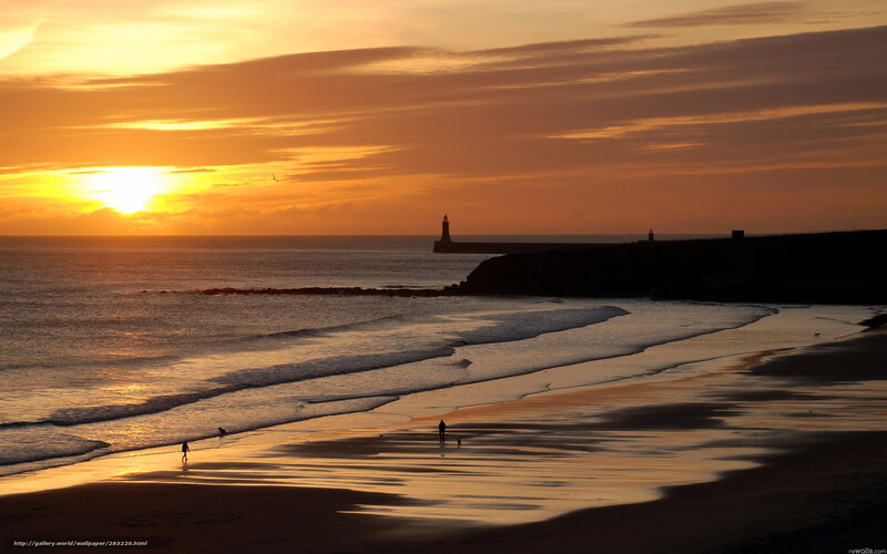 Silhouetted People on Beach — Orange, Serene, Sunset, Photograph, Lighthouse, Ocean