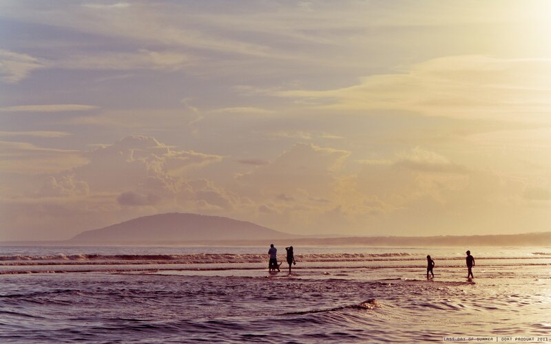Silhouetted People on Beach — Purple, Serene, Sunset