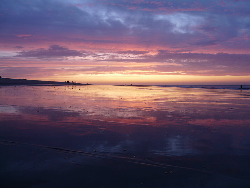 Silhouetted People on Beach — Purple
