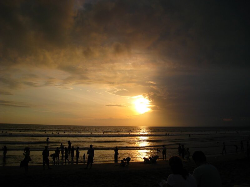 Silhouetted People on Beach — Yellow, Dramatic, Sunset, Photograph