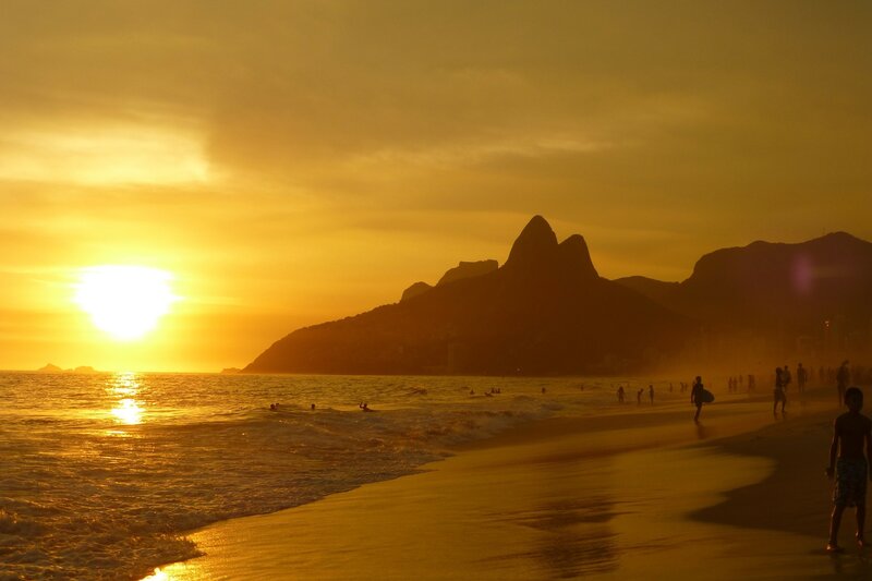 Silhouetted People on Beach — Yellow, Serene, Sunset