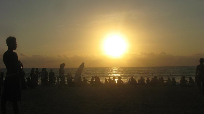 Silhouetted People on Beach — Yellow