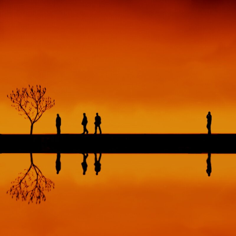 Silhouetted People on Bridge