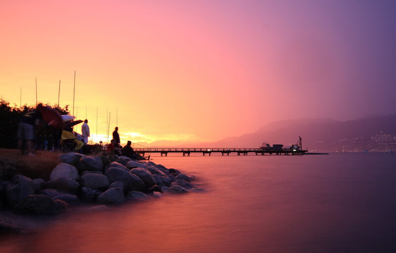 Silhouetted People on Dock