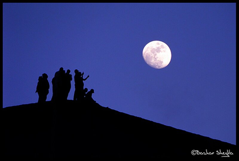 Silhouetted People on Hill — Blue