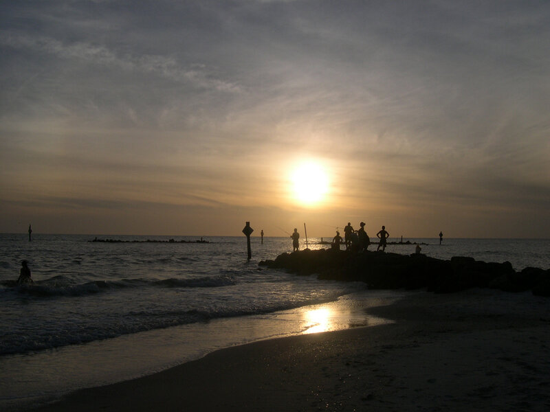 Silhouetted People on Jetty