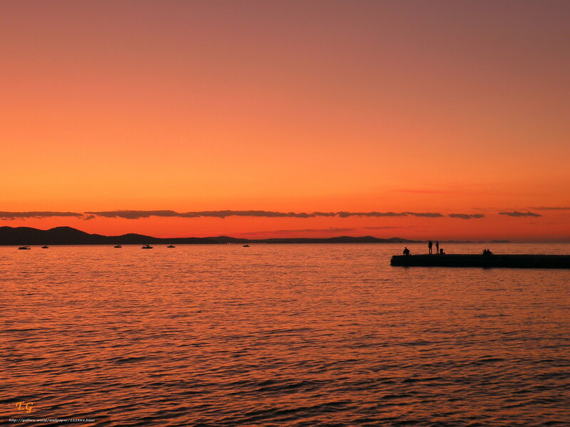Silhouetted People on Pier — Orange, Serene, Sunset, Photograph, Boats