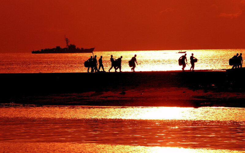 Silhouetted People on Pier — Red