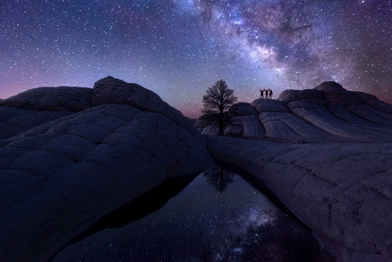 Silhouetted People on Rock