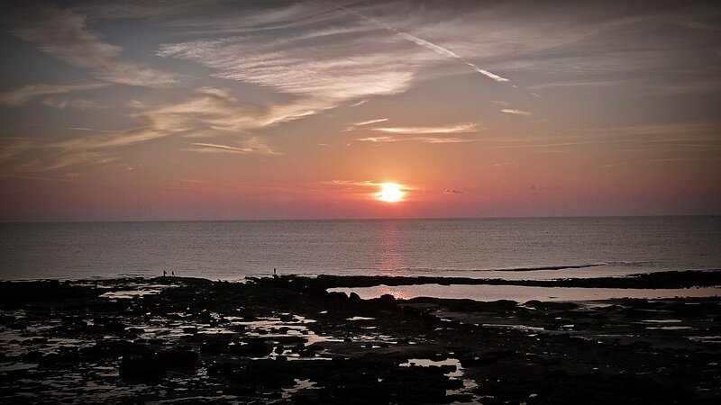 Silhouetted People on Shore