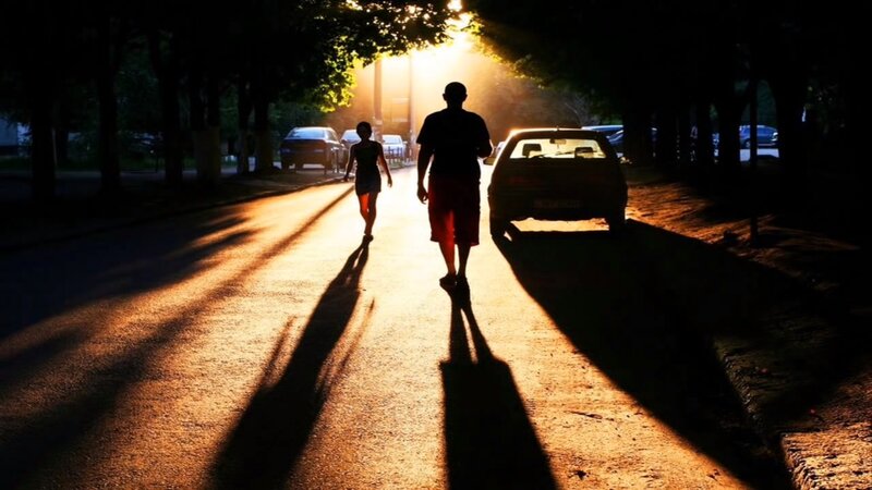 Silhouetted People Walking — Black