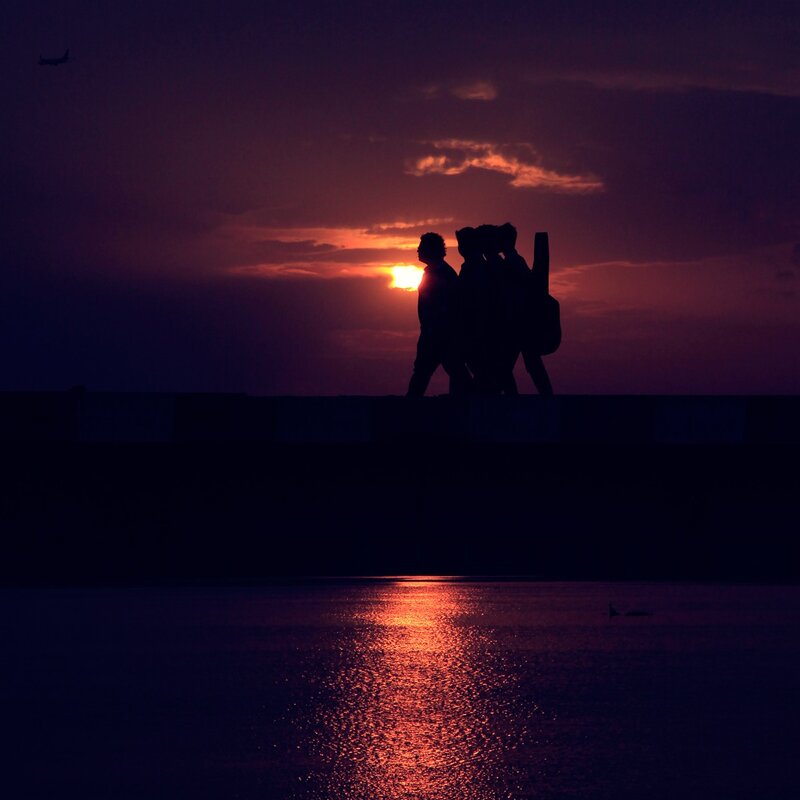 Silhouetted People Walking — Purple