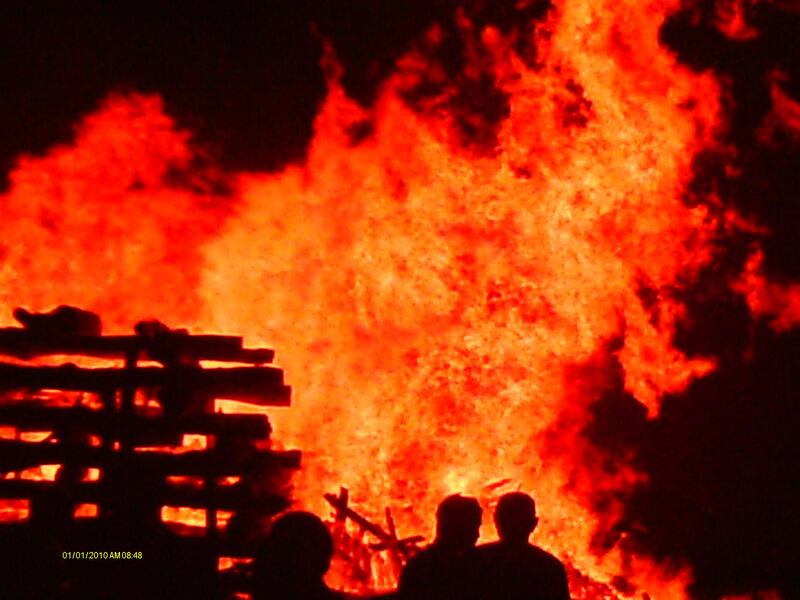 Silhouetted People Watching Fire