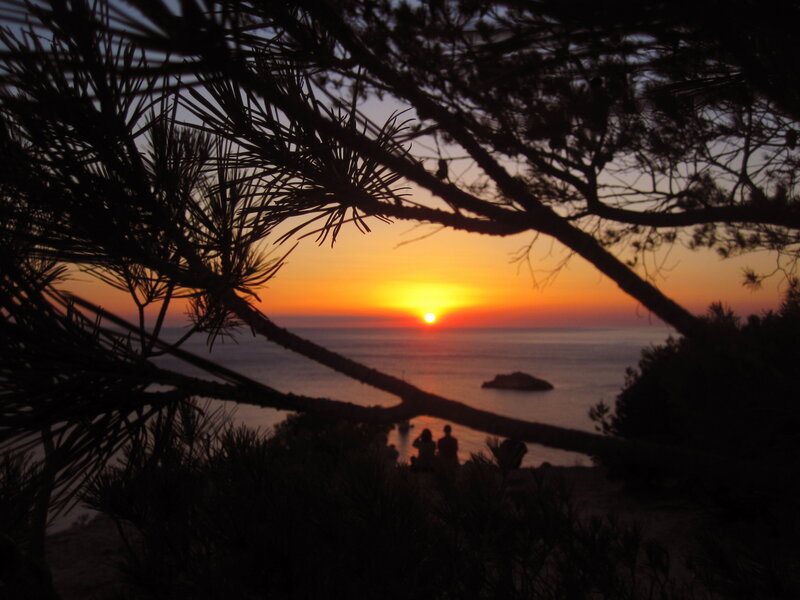 Silhouetted People Watching Sunset — Orange