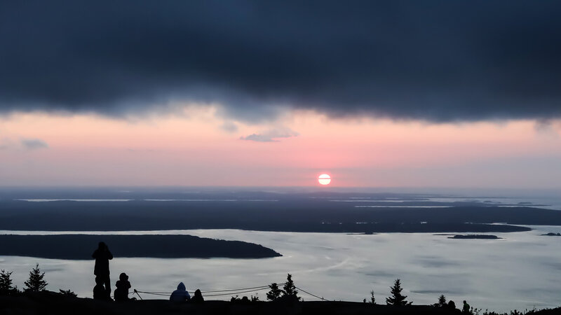 Silhouetted People Watching Sunset — Pink