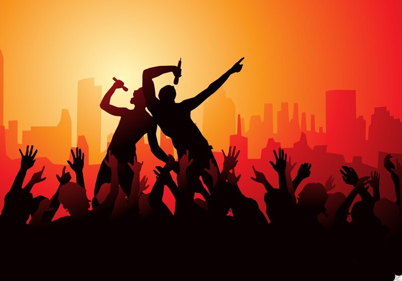 Silhouetted Performers on Stage — Orange