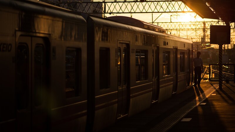 Silhouetted Person on Platform — Gold