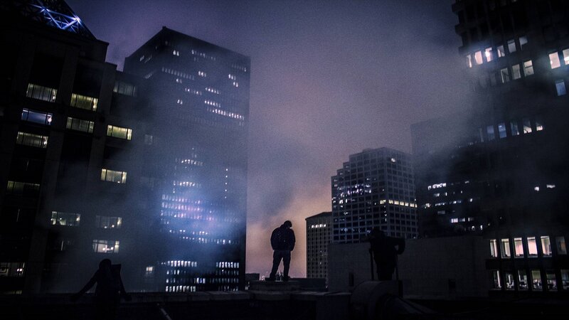 Silhouetted Person on Rooftop
