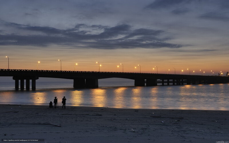 Silhouetted Photographers on Beach