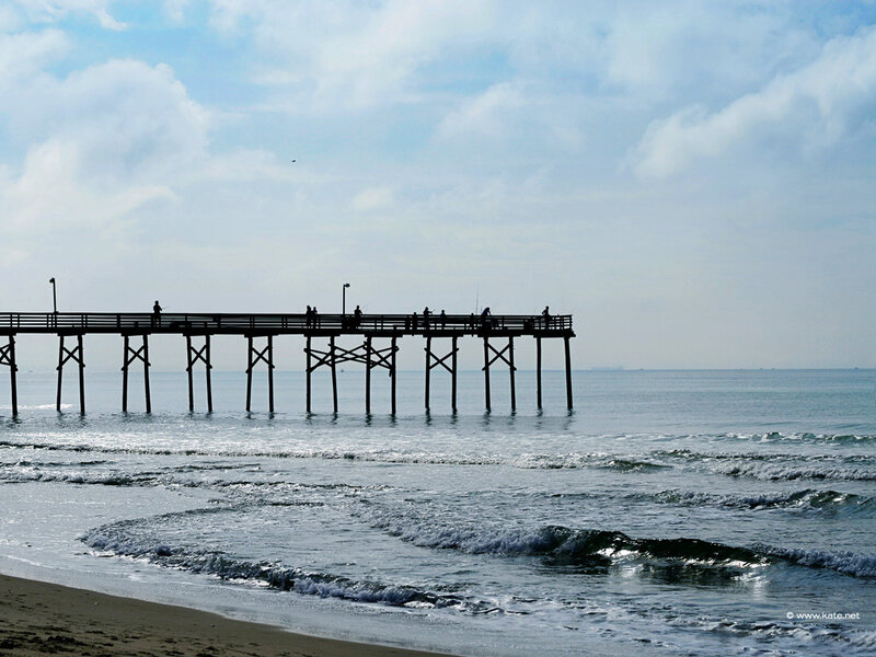 Silhouetted Pier at Beach