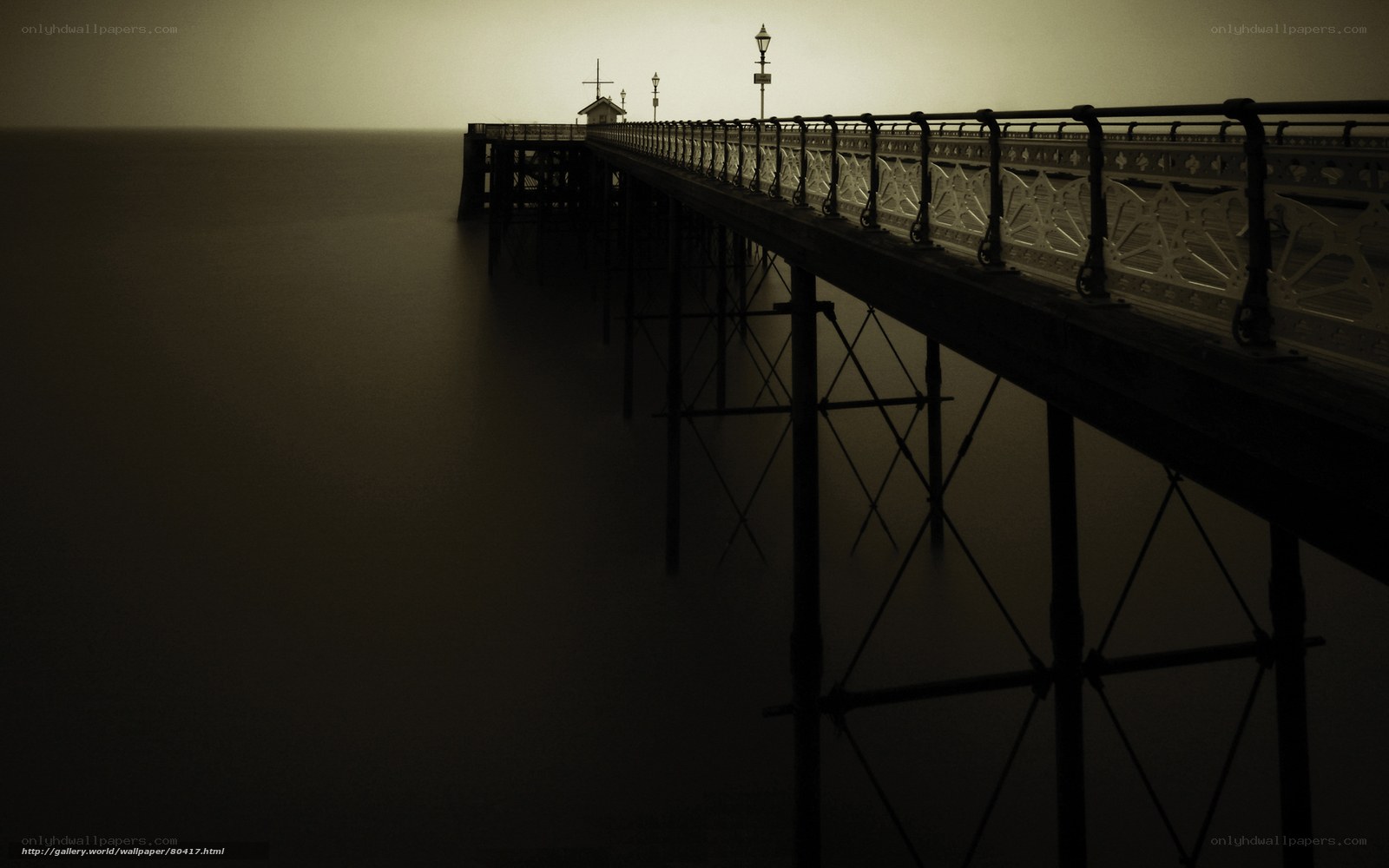 Silhouetted pier at dusk
