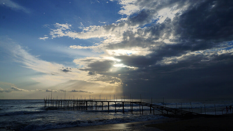 Silhouetted Pier at Sunset — Blue, Dramatic