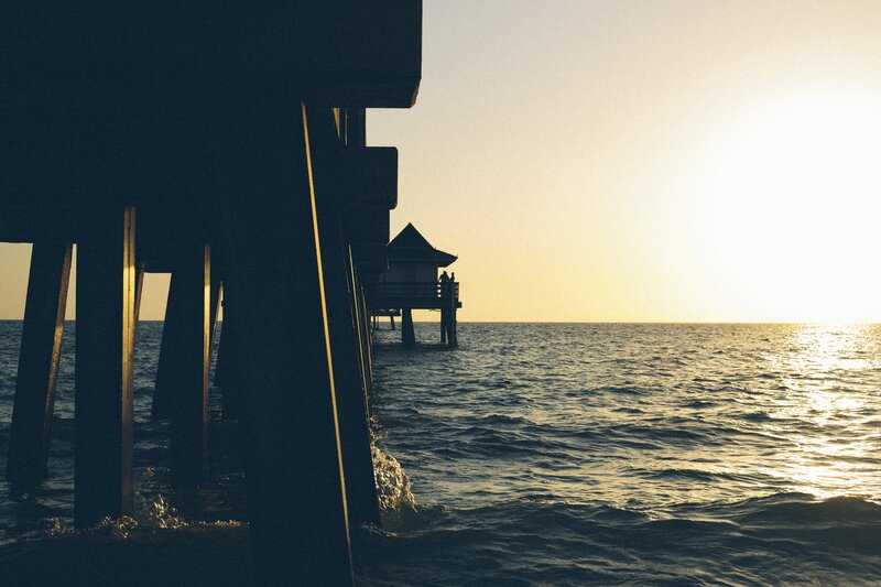 Silhouetted Pier at Sunset — Blue, Serene, Photograph, Ocean