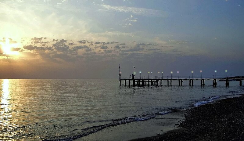 Silhouetted Pier at Sunset — Blue, Serene