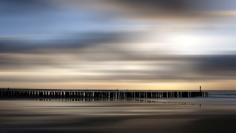 Silhouetted Pier at Sunset — Blue